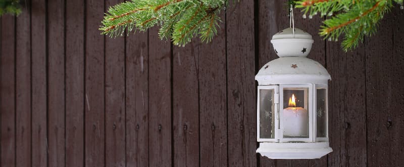 white festive lantern on fencing